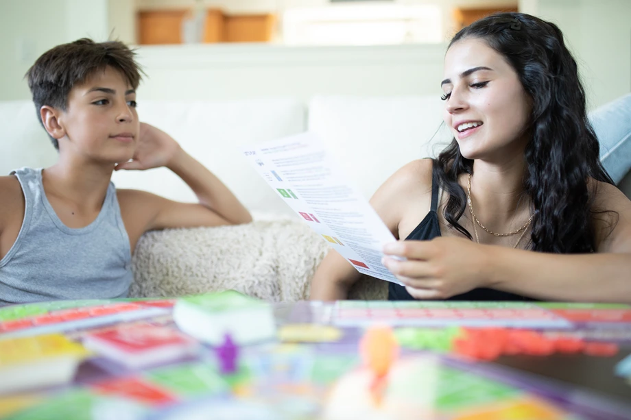 photo of homeschool children playing cashflow board game